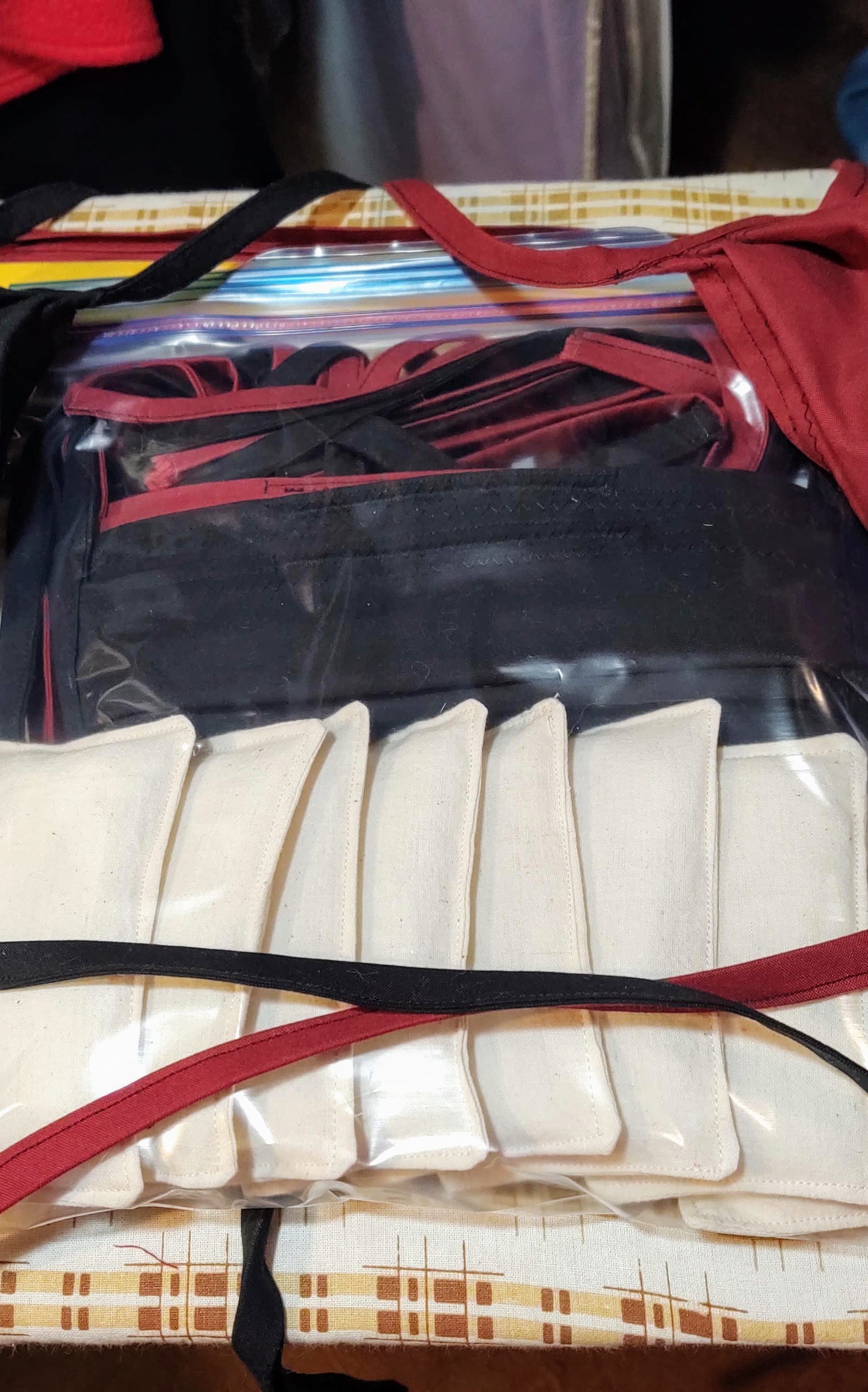 April 2020 gallery, handmade masks on an ironing board.