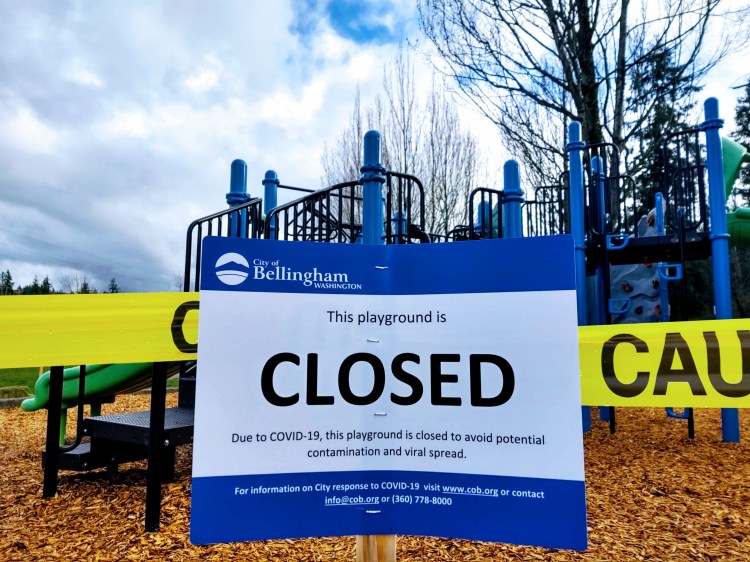 March 2020 gallery, a sign in front of caution tape that states "this playground is closed due to COVID-19"